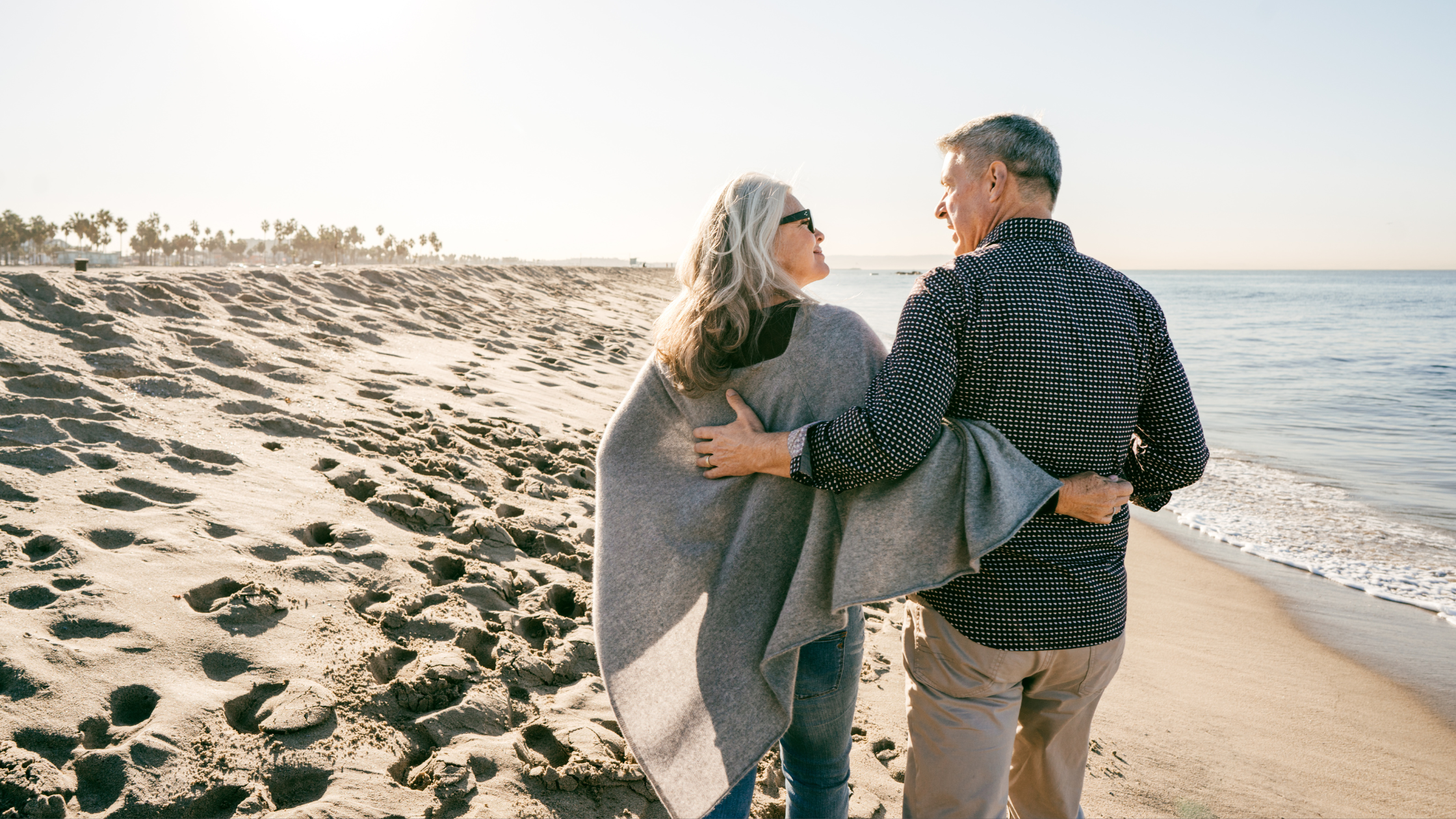 Couple on the beach on a sunny day.