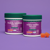 Product Image for Two purple bottles of focus and attention CBG gummies on purple background