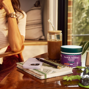 Product Image for Purple bottle of focus and attention gummies on desk in front of coffee cup