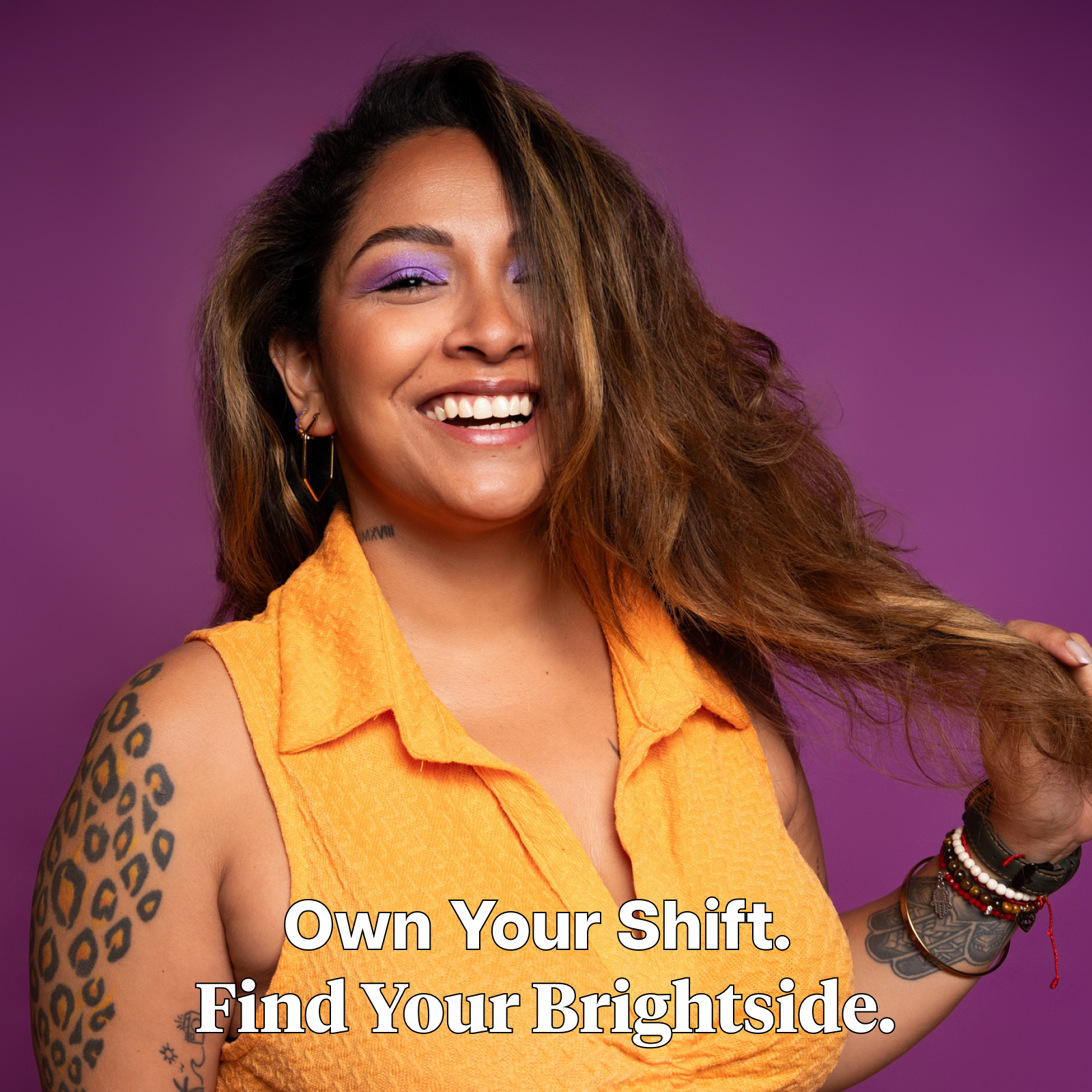 Product Image for Woman with long hair and tattoos wearing an orange sleeveless top against a purple background with text, "Own Your Shift. Find Your Brightside."