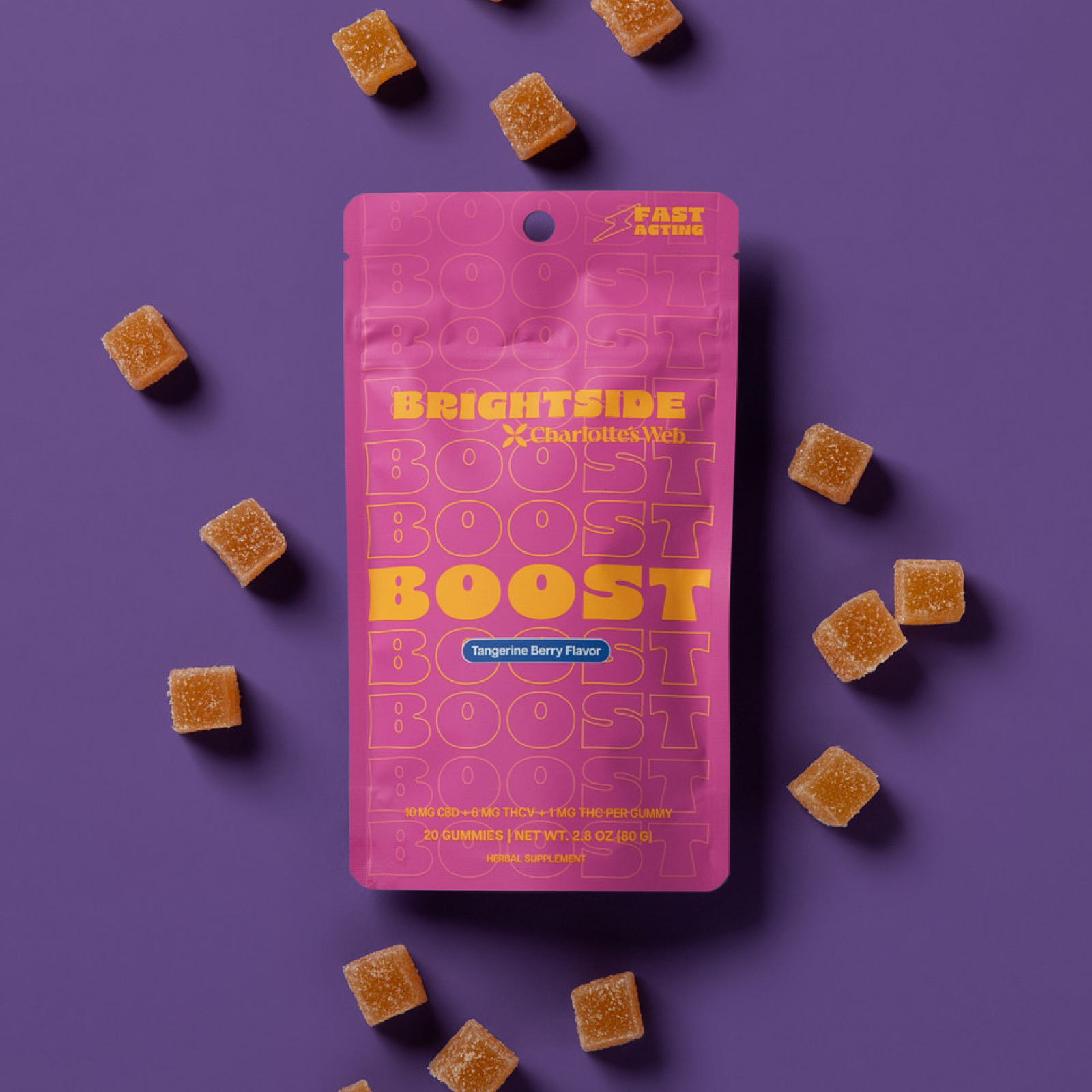 Product Image for Pink Charlotte's Web Brightside Boost gummy package with orange gummies on a purple background