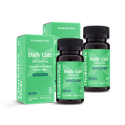 Product Image for Two bottles and two boxes of Charlotte&#39;s Web Daily Care CBD Soft Gels on a white background