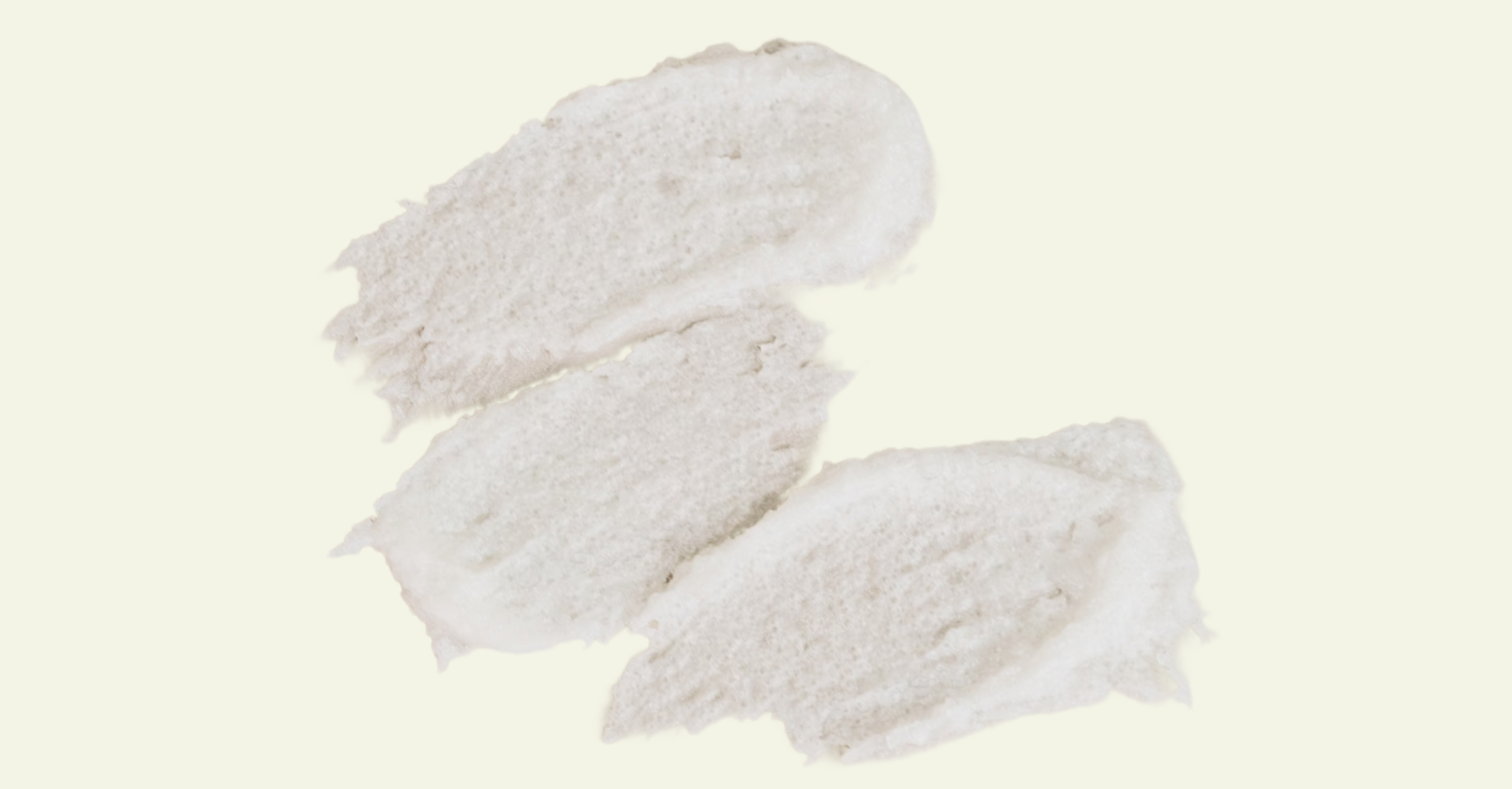Three white fish fillets on a light beige background