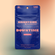 Product Image for Blue packaging of Charlotte's Web Brightside Downtime gummies on a colorful background
