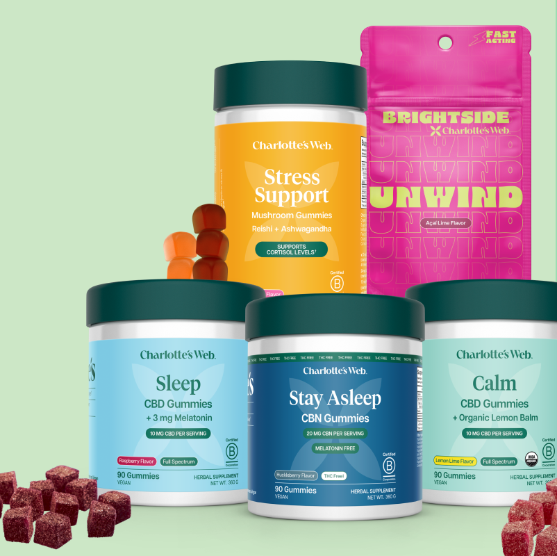 Collection of Charlotte's Web CBD gummy containers on a light green background