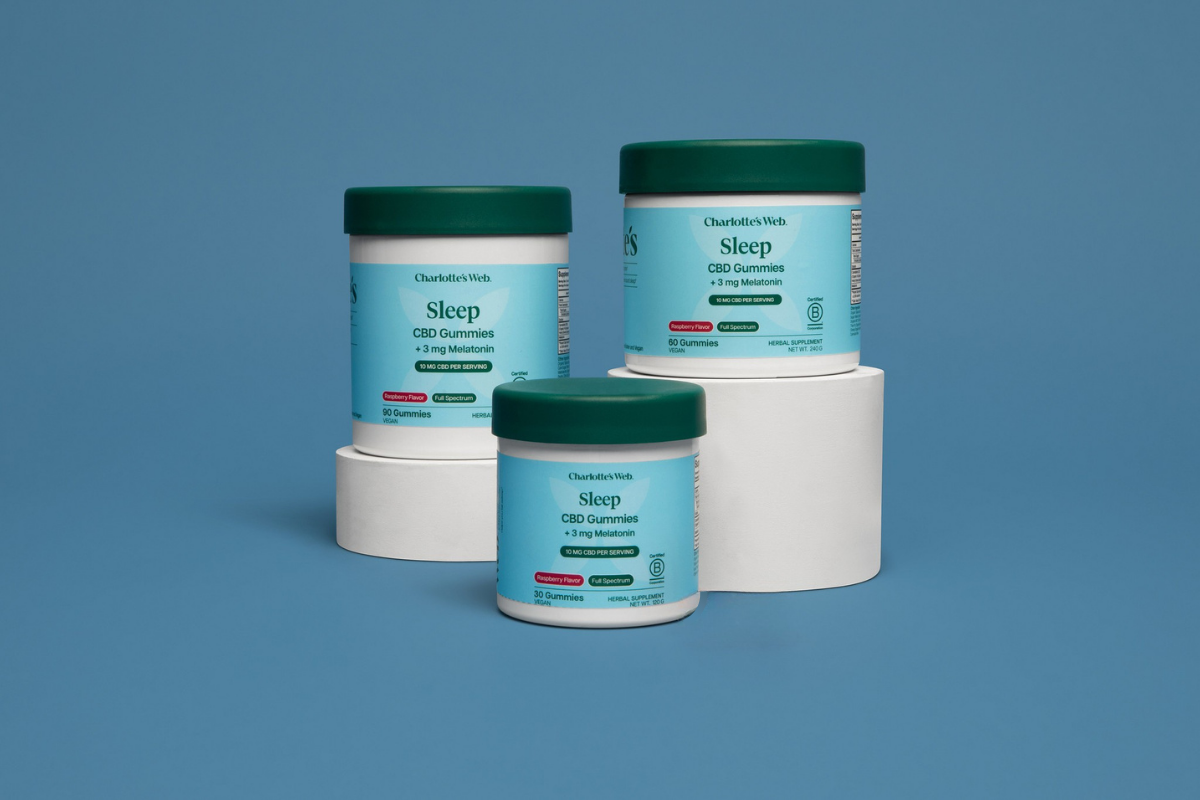 Three containers of a product labeled 'Sleep' on a blue background