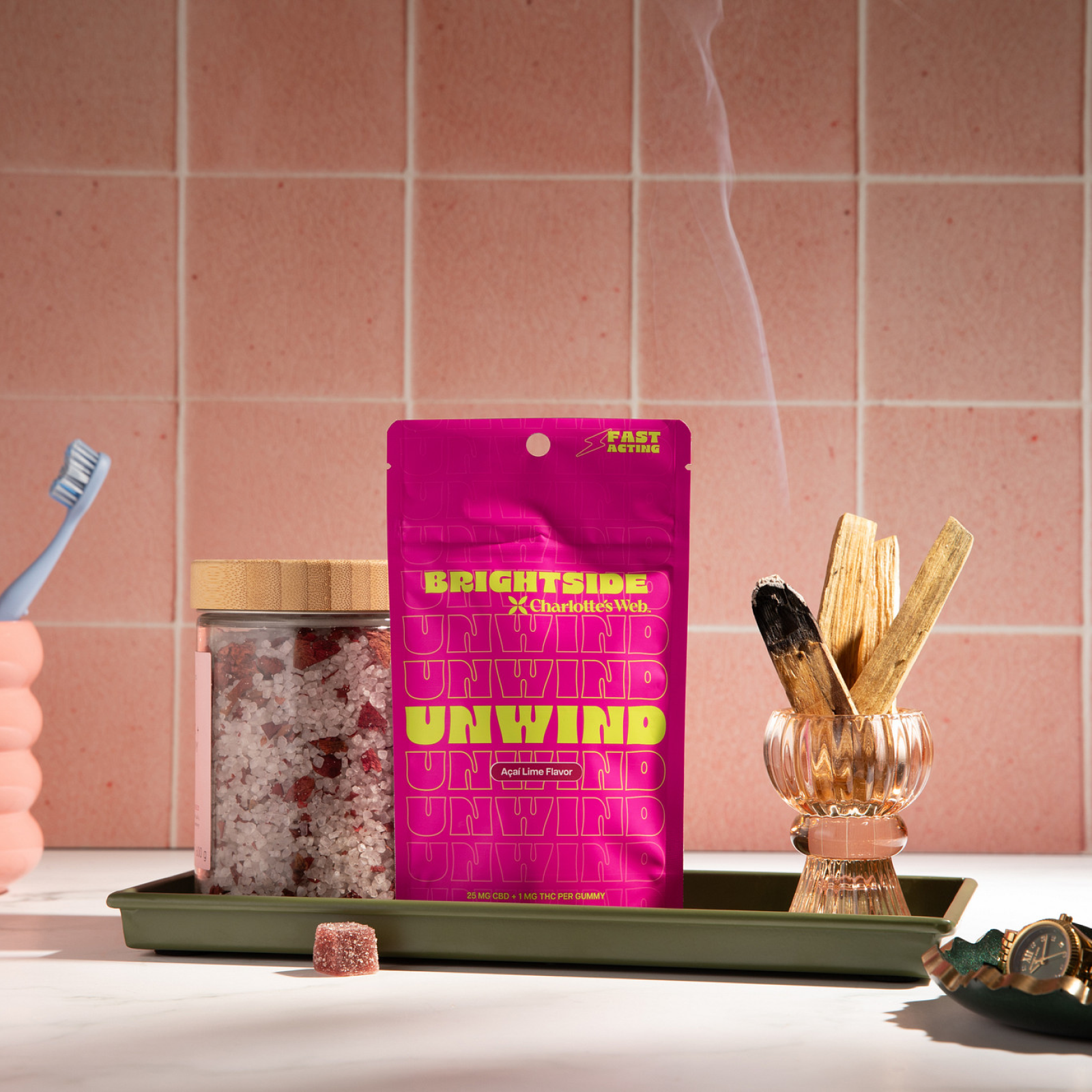 Product Image for Pink package labeled &#39;UNWIND&#39; on a tray with a pink tiled wall background